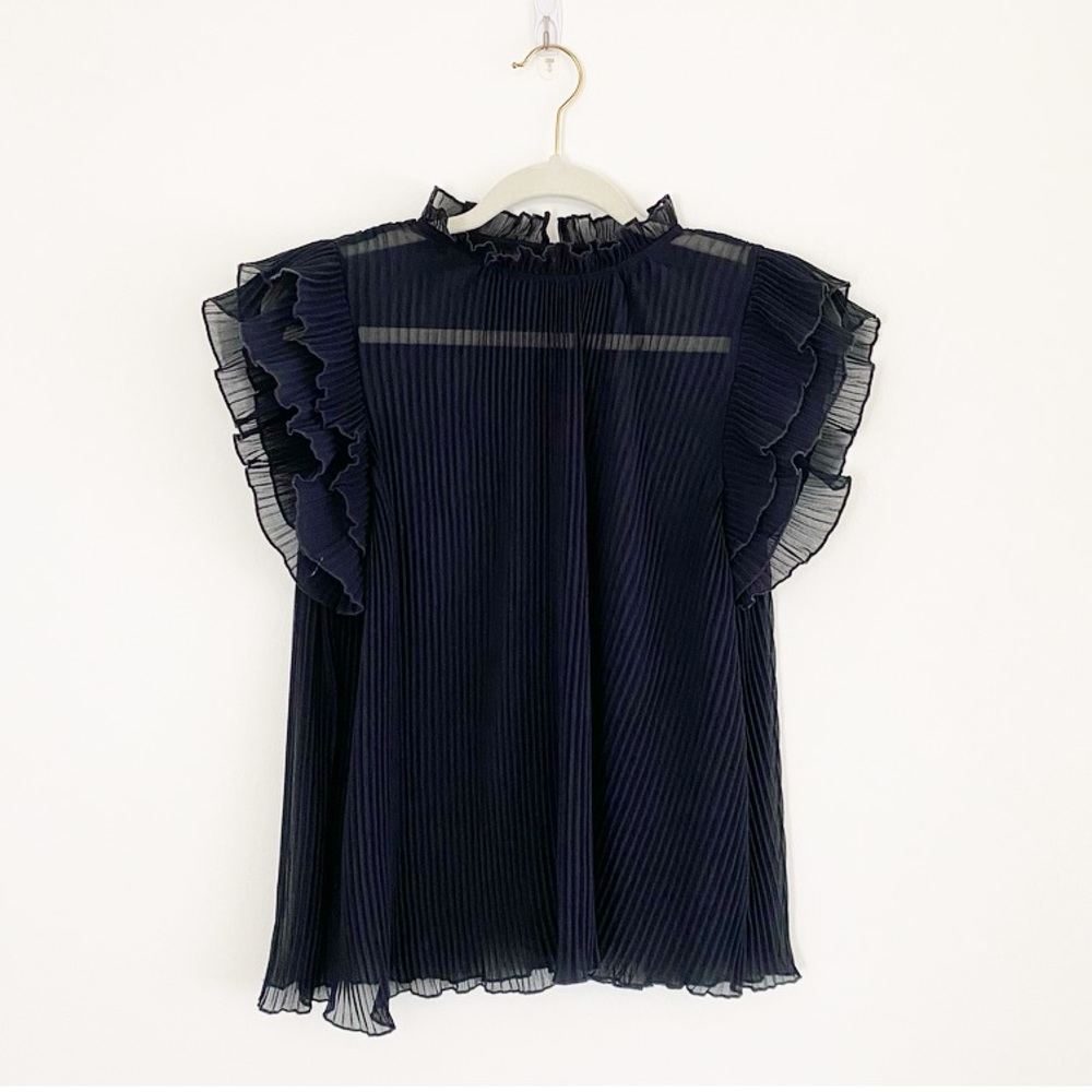 Black platted top by Anthropologie